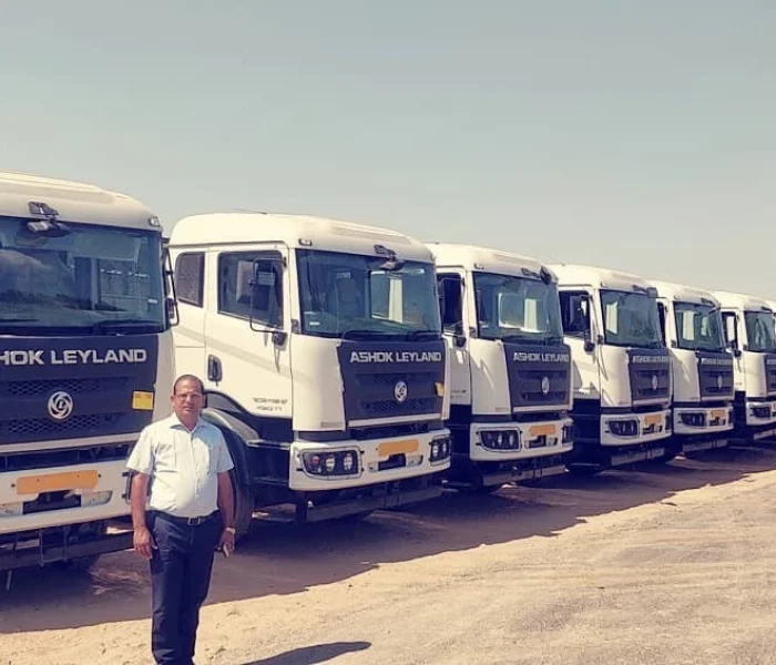 Fleet of transport trucks parked at a depot